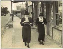 Free download [Street Scene, Natchez, Mississippi: Two Women Walking along Sidewalk before Storefront] free photo or picture to be edited with GIMP online image editor